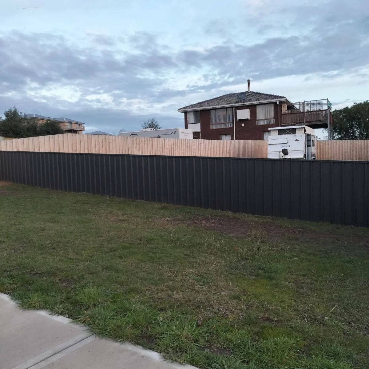 Colorbond fence along a house boundary